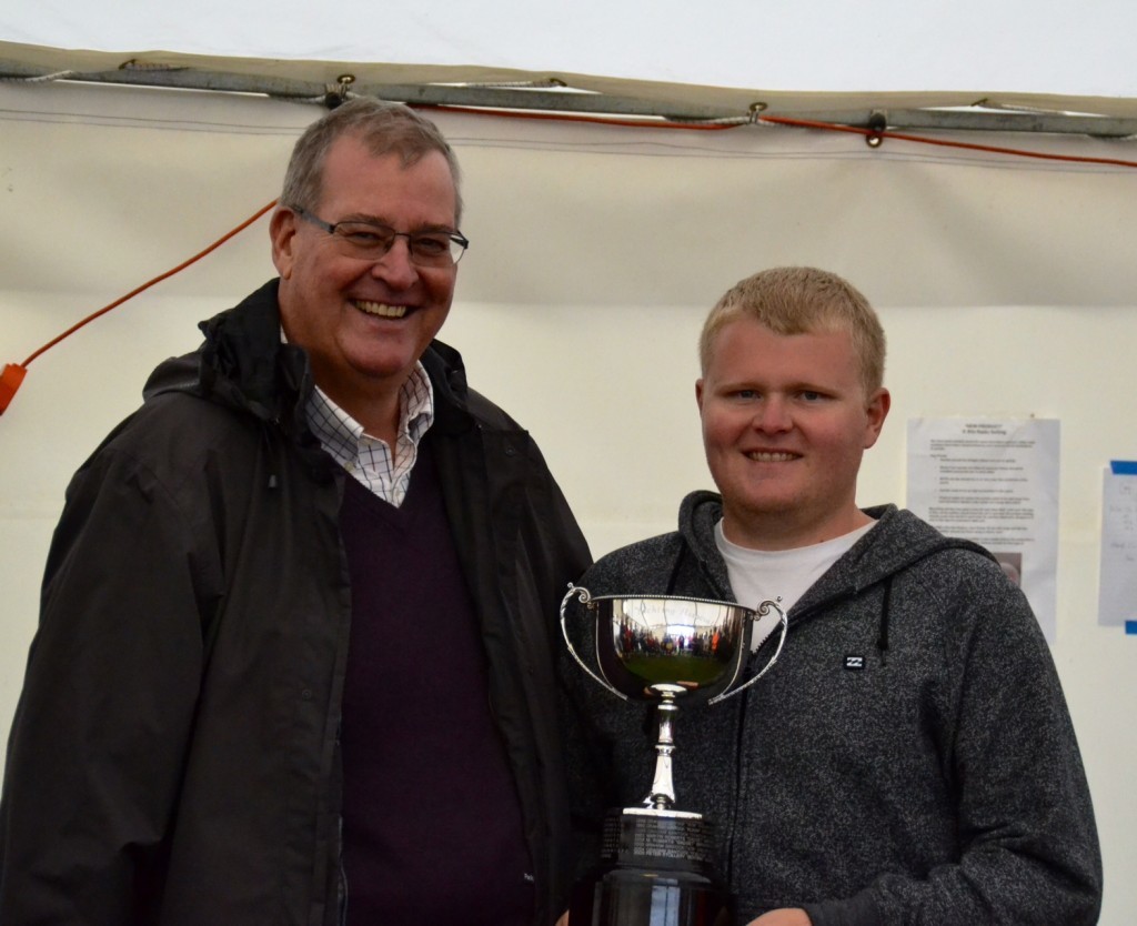 Rob Walsh (R) accepts the winners Trophy from Keith Coxon - image by Sue Brown