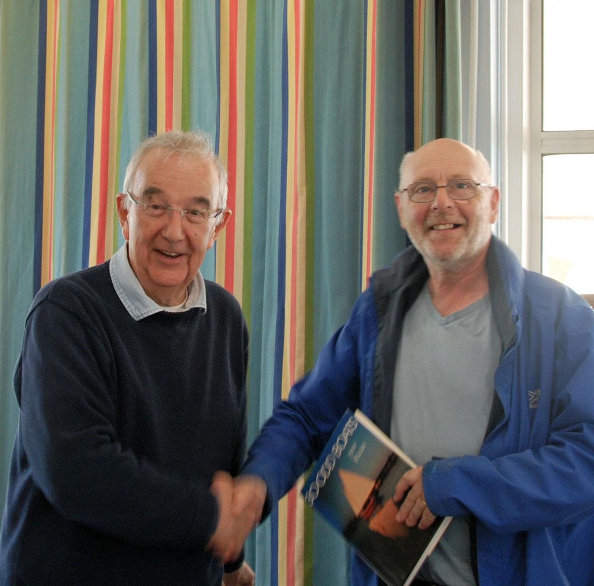 Peter Mitchell on the left and Peter Shepherd receiving his prize